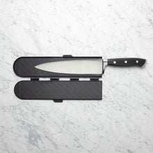 Load image into Gallery viewer, Knife with a black handle and blade cover on a white marble background