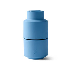 Load image into Gallery viewer, A sky blue, cylindrical Billund CrushGrind mill, featuring a silicone plug at the bottom.