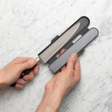 Load image into Gallery viewer, Person holding a knife with a sheath on a light gray background