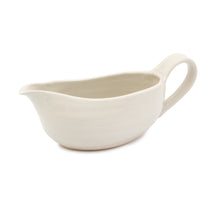 Load image into Gallery viewer, A pale cream ceramic gravy jug on a white background