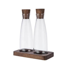 Load image into Gallery viewer, two glass bottles with wooden stoppers in a wooden tray
