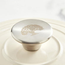 Load image into Gallery viewer, A green cast iron casserole dish with lid and two handles on a kitchen counter. Steel handle.