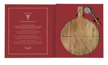 Load image into Gallery viewer, an open book with a pizza cutting board and pizza cutting wheel set in to a red page
