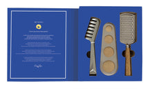 Load image into Gallery viewer, Set of kitchen tools including pasta tongs, spaghetti measure, and grater on a blue background with a gift card.
