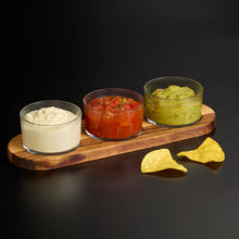 Load image into Gallery viewer, Three glass bowls with different dips on a wooden board with tortilla chips on a black background

