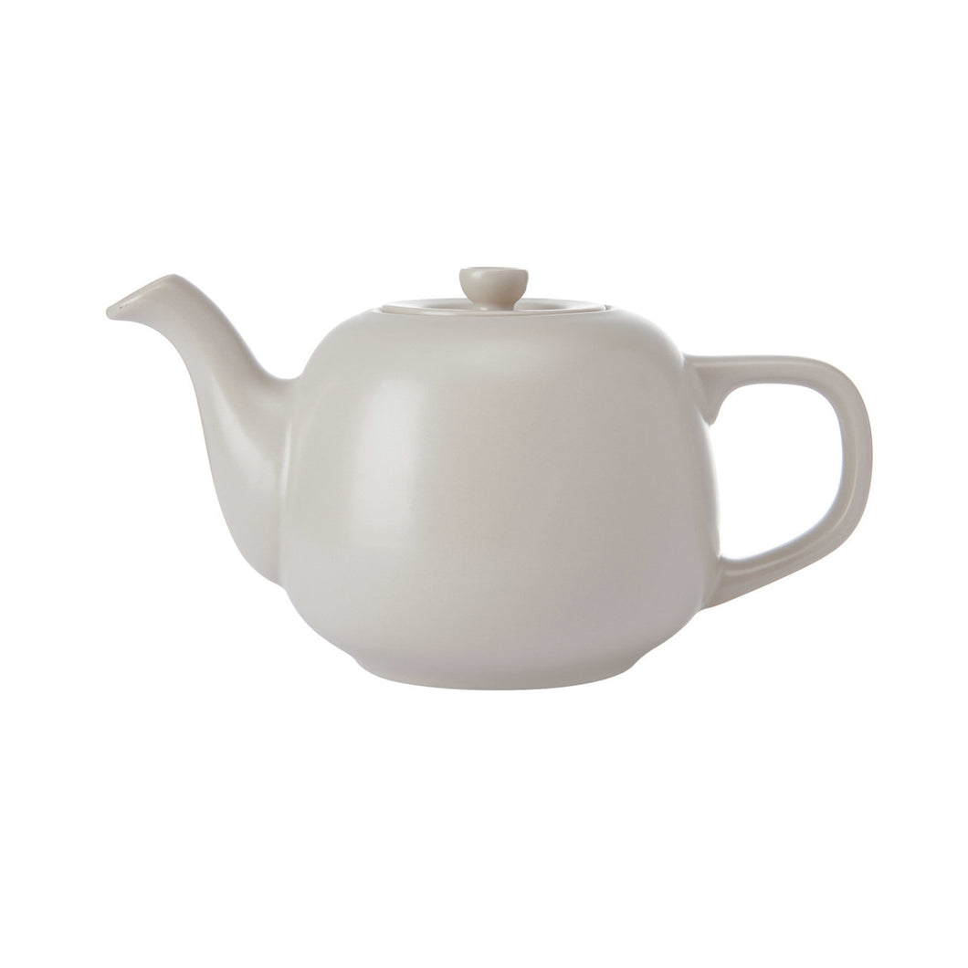 Latte colour ceramic teapot on a white background
