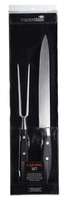 Load image into Gallery viewer, Masterclass carving set in packaging with knife and fork on a black background
