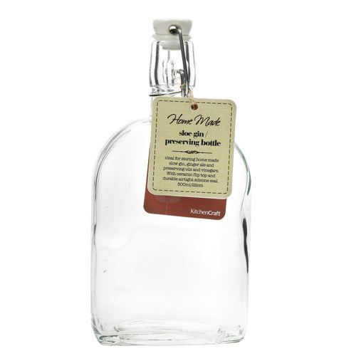 A clear glass flask bottle with a clip top and a label that reads 'Home Made Preventing Bottle'.